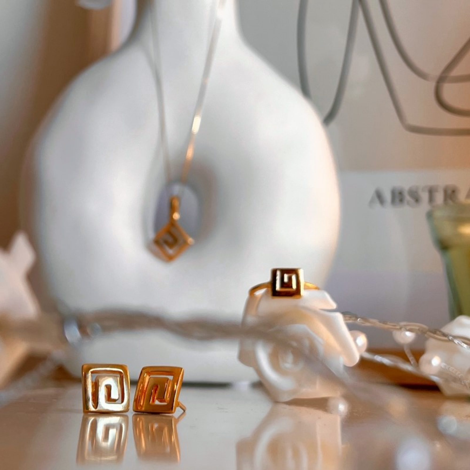 Σκουλαρίκια μαίανδρος καρφωτά επίχρυσα