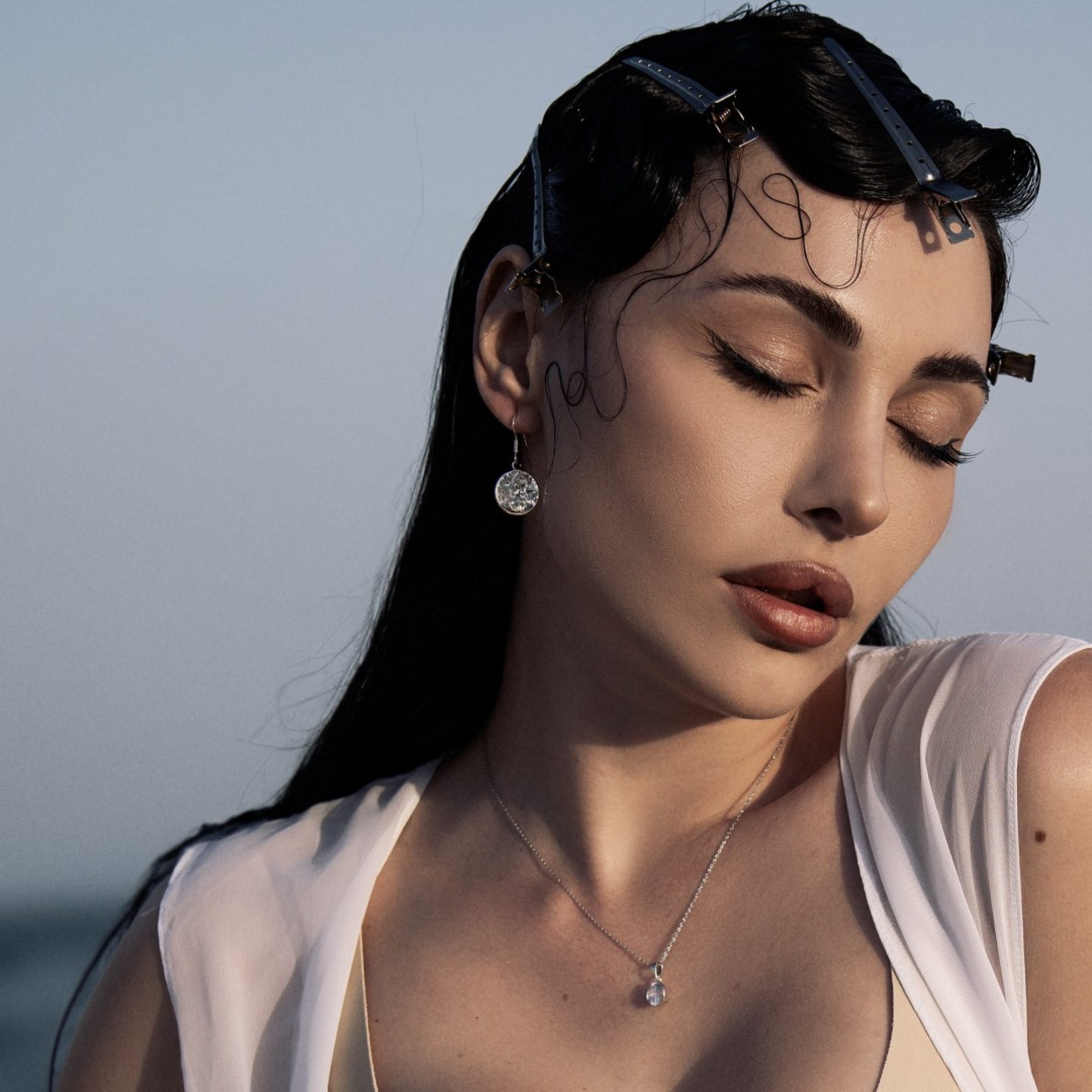 Silver dangle earrings with zircon stone