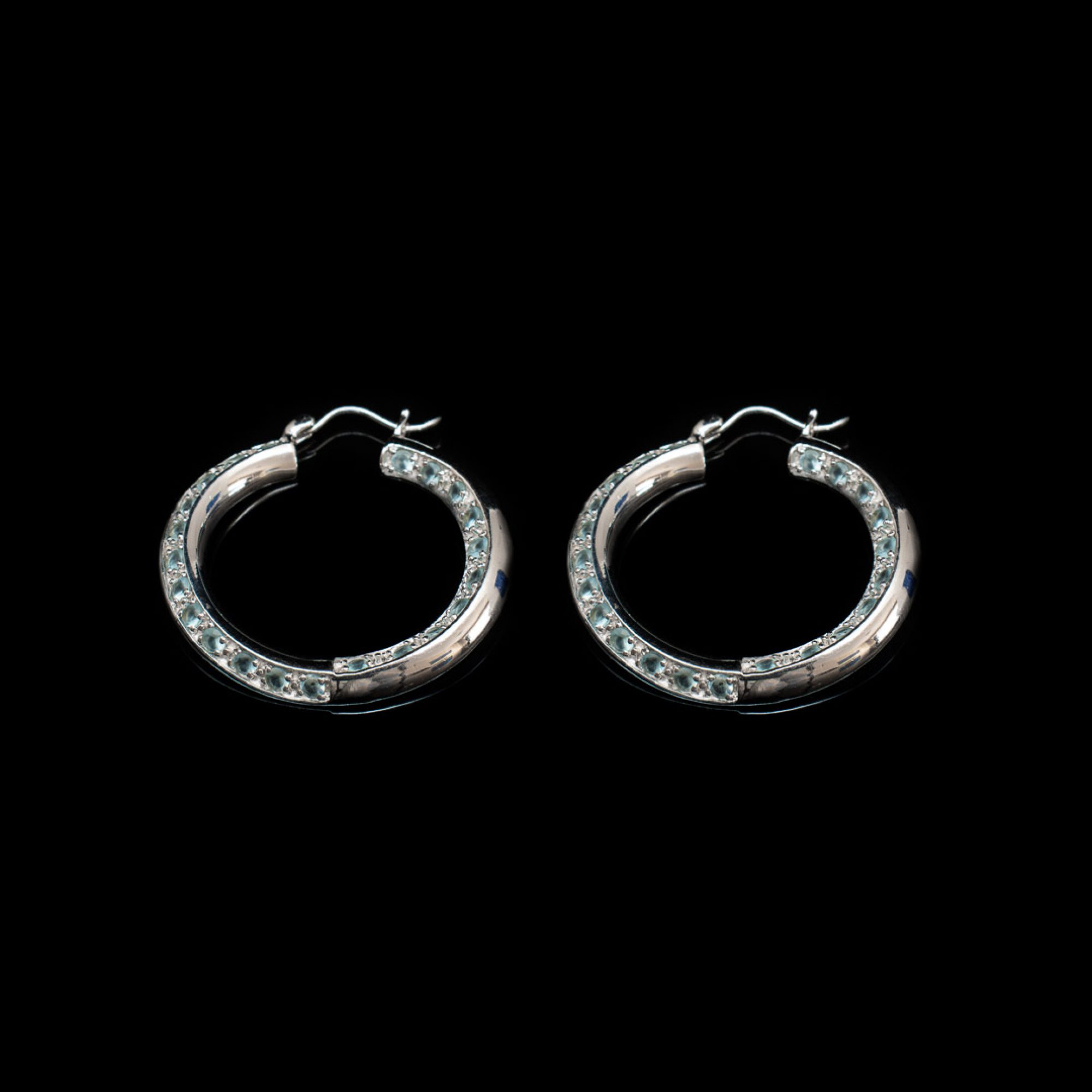 Silver hoops with aquamarine stones