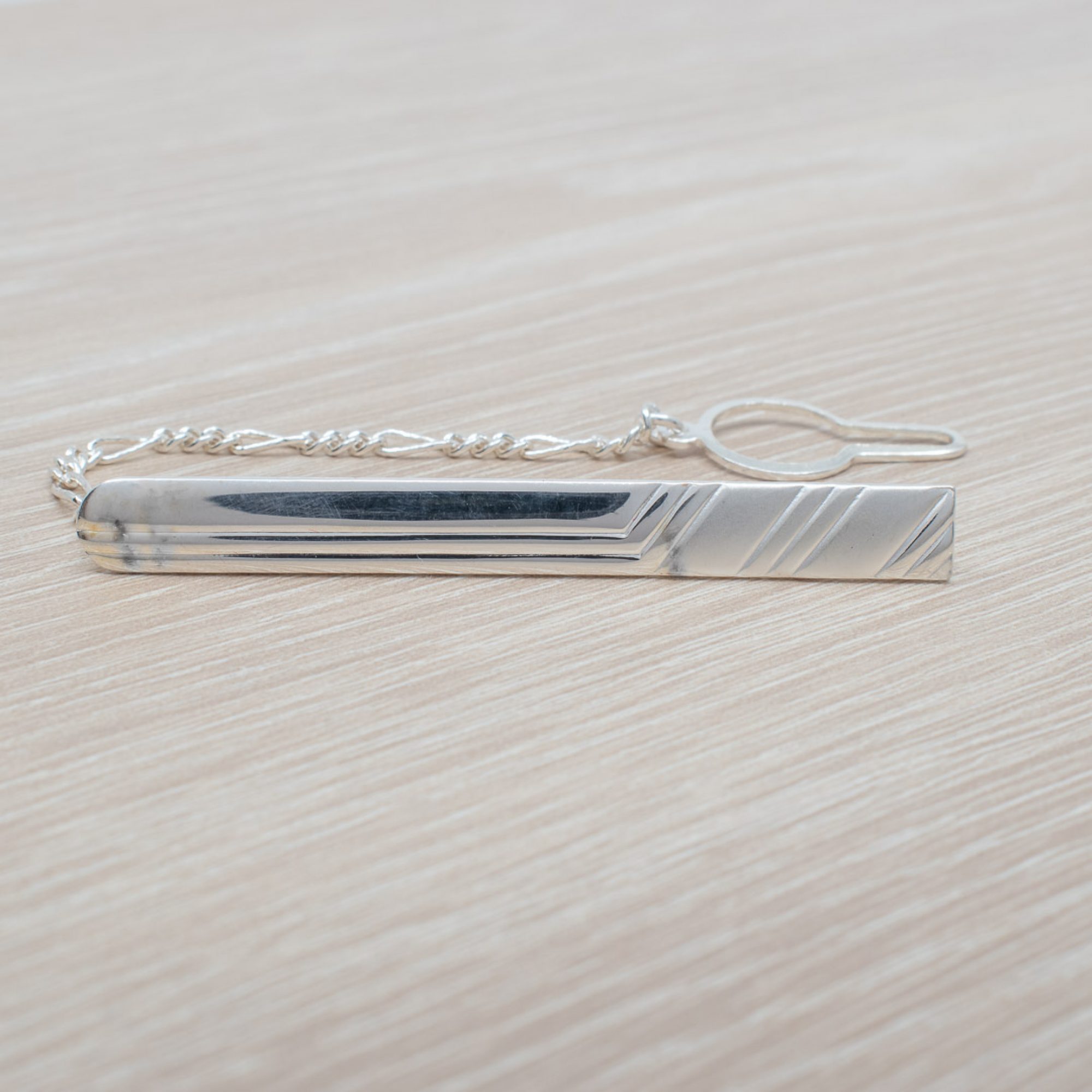 Silver tie bar with chain