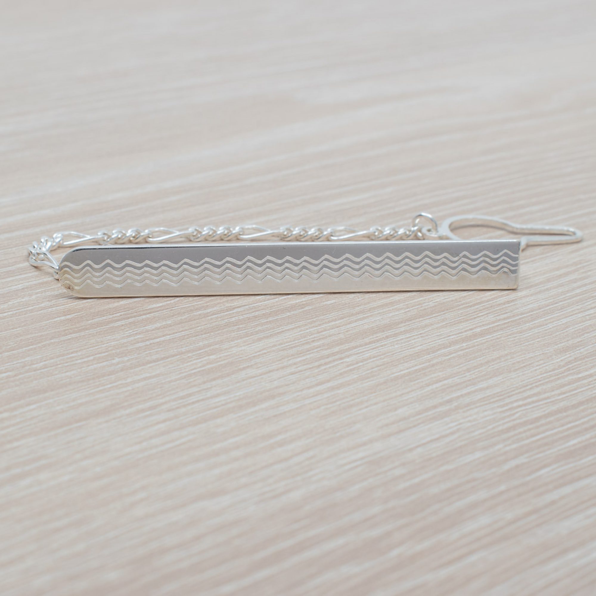 Silver tie bar with chain